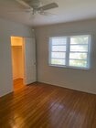 Bedroom with walk in closet and ceiling fan - 449 San Vicente Blvd Unit 4