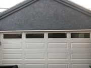 Two-car garage with sliding doors leading to private back patio. - 806 E 65th St House