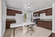 Photo - 1401 E 118th St Townhome