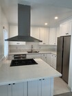 Kitchen with Cooking Island - 325 S Doheny Dr Apartments Unit 4