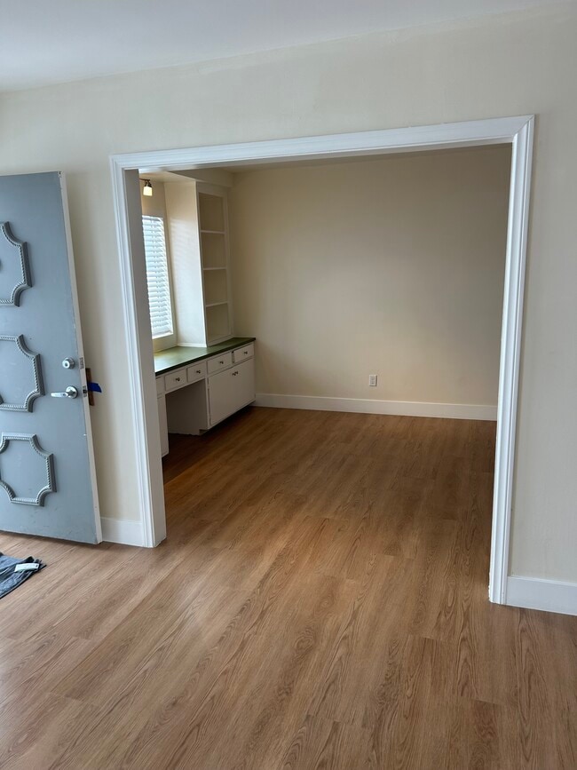 Entrance with living room on the left. - 1137 12th St Unit #9. 2 bedroom plus den