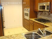 Photo - 10640 Woodbridge St Townhome