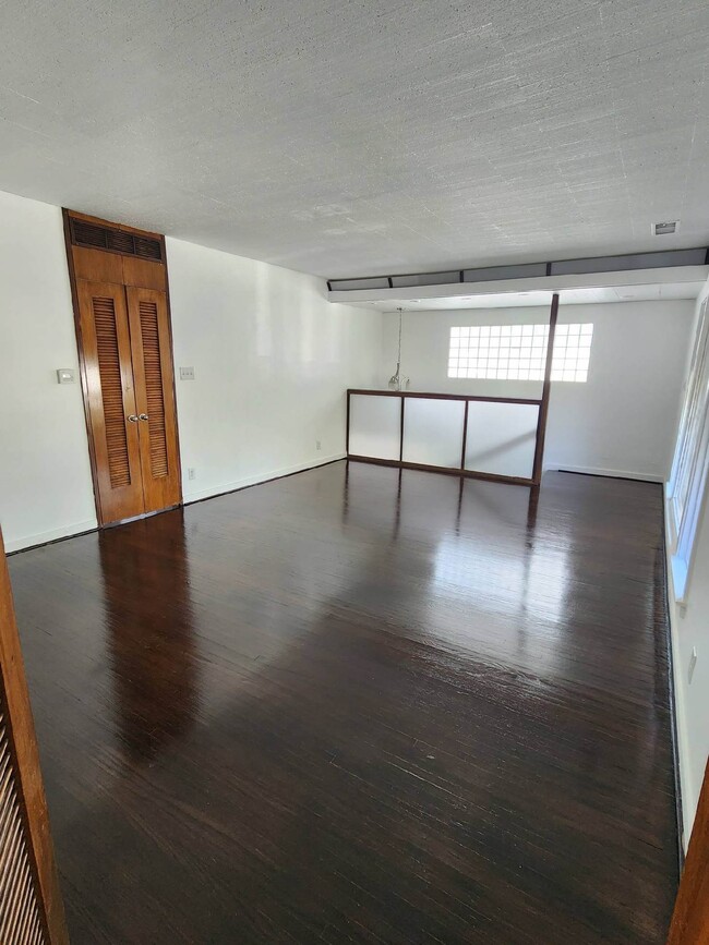 Living Room with double doors to bedrooms, bathroom and washer & dryer - 1251 S Sycamore Ave Unit Sycamore Retreat