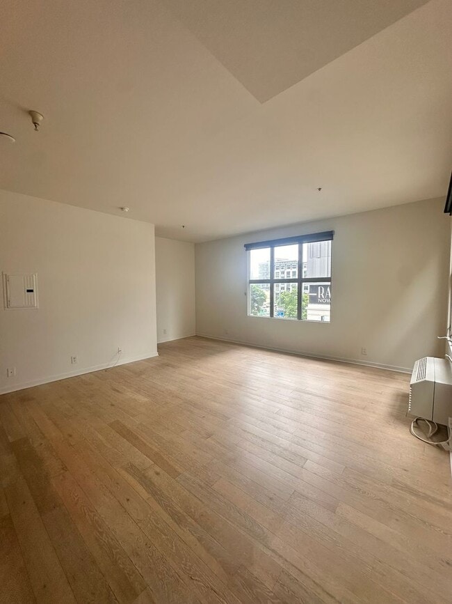 Building Photo - DOWNTOWN GEM | Modern Two-Level Loft with Private Patio & Rooftop Deck
