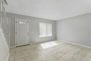 2BR, 1.5BA - 925SF - Living Room - Village Green
