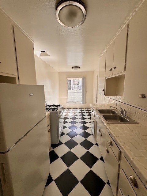 view of kitchen from entry - Loma Linda Apartments