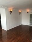 Beautiful living room with beautiful floors throughout the unit. - 1857 Pandora Ave Apartments Unit 1857