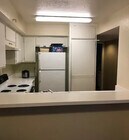 Stove and Refrigerator are now updated - 15000 Downey Ave Condo Unit #142
