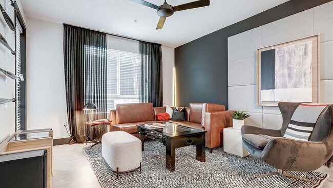 Griffis Platinum Triangle apartment living room with wood style flooring. - Griffis Platinum Triangle