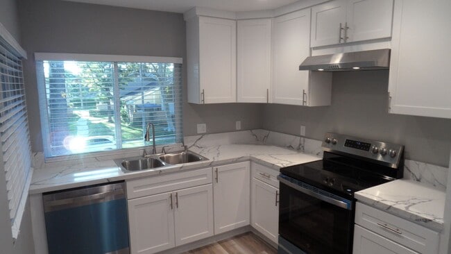 Building Photo - REMODELED 2BR; 1BA end Unit B