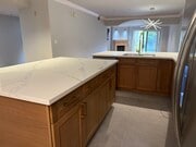White Oak kitchen with quartz countertops - 6221 Monterey Rd Unit East