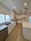 Open kitchen with beautiful marble counter, great for entertaining. - 1062 S Shenandoah St Apartments Unit 1062