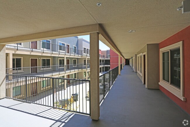Inner access to apartments with view of courtyard at City Plaza Apartments in Escondido, California. - City Plaza Apartments