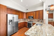 2BR, 2BA - 1294SF - Kitchen - Serrano Luxury Homes and Garden