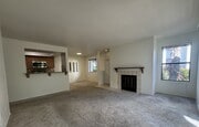 living room, dining room, fireplace, and kitchen - 9408 Twin Trails Dr Unit 106