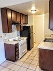 Kitchen with stove, refrigerator, and dishwasher. - 3717 Cardiff Ave
