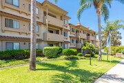 56 4th Ave Chula Vista CA-Exterior View with flags - Elan Villa Parq Apartments