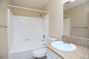 Bathroom showing Shower toilet and sink - Benchmark Apartments
