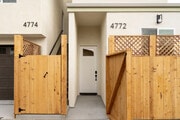 View of front door and private garage space - 4772 Bancroft St Townhome