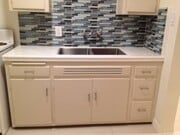 Kitchen with Blue Glass backsplash + deep stainless steel sink - 1314 N Vista St Apartment Unit 1314