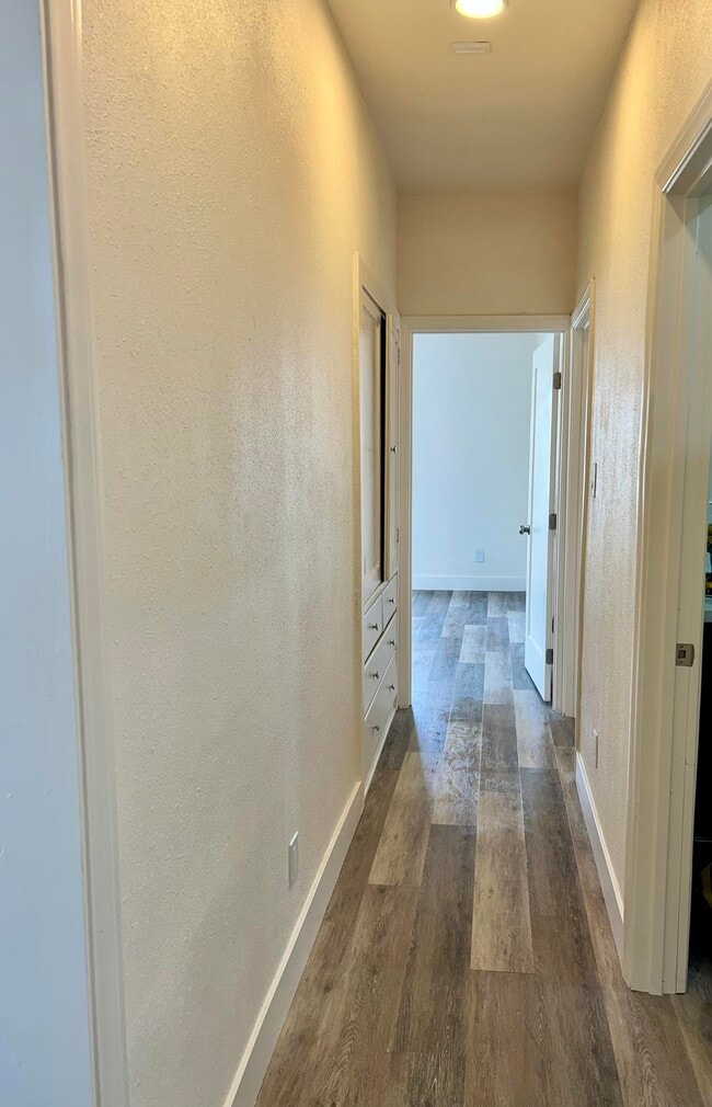 Hallway featuring a linen closet. and drawers. Perfect for towels & sheets. - 4043 1/2 W 21st St Unit 4043  half