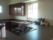 Gorgeous kitchen with slide-in stove, stainless steel sink, faucet with pull-down sprayer, garbage disposal, and dishwasher! - 400 East Airport Avenue