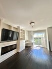 Family room on 2nd Story with Built in Cabinetry - 7870 Civita Blvd Townhome