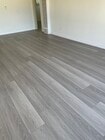 part of living room with new waterproof engineer planks - 25219 Loytan St Apartments Unit #c