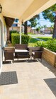 Private front patio with seating area, greenery, and a quiet outdoor space to relax. - 339 E Taft Ave Unit 2