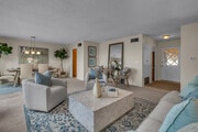 Living room with dining area and fireplace - 28845 Briarhurst Dr House