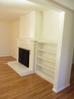 Fireplace and bookshelf in living room - 1640 Dwight St