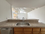 view from Kitchen to Living Area - 518 Dahlia Ave Apartments Unit 518.5 Back