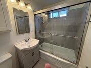 Bathroom vanity and shower enclosure. - 1755 Silver Lake Blvd Unit 1755