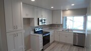 Photo - REMODELED 2BR; 2BA end unit condo with 1 car garage & 1 parking space