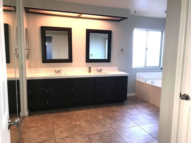 Photo - Vista home with a 2 car garage and additional parking