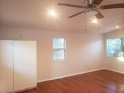 Bright main living area with ceiling fan. - 4966 Twining St