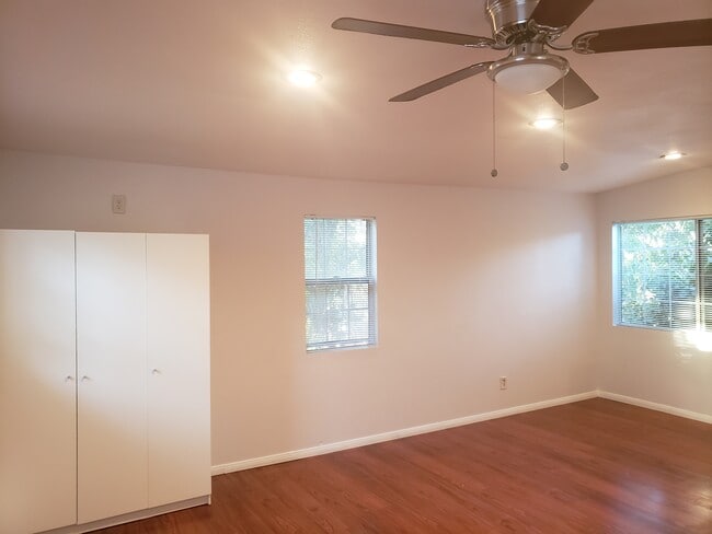 Bright main living area with ceiling fan. - 4966 Twining St