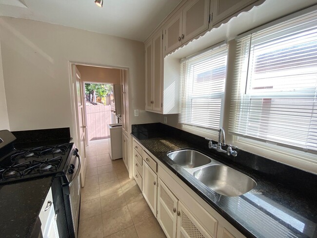 Photo - Cozy North Park Cottage with Enclosed Patio Exclusive Assigned Garage! Air Conditioning! In Unit ... Unit 4077 Iowa St