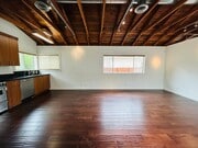 Photo - Spacious One Bedroom + Den Backhouse! In Unit Laundry! Prime Location!