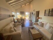 Living room with high ceiling - 112 19th St Unit Beach Bungalow