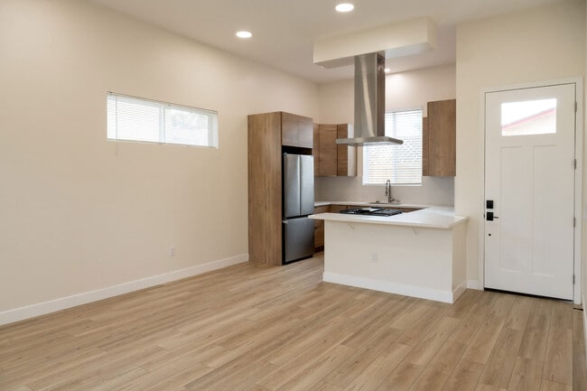 View of kitchen and front door - 4772 Bancroft St Townhome
