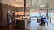 Chef's kitchen with refrigerator and wine refrigerator. - 3078 Saddleback Ct
