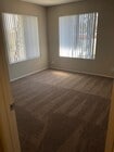 Large bedroom with lots of natural light at Grande Vista Apartments. - Grande Vista Apartments
