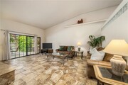 Living Room, Vaulted Ceiling, with working fireplace. - 46375 Ryway Pl Townhome