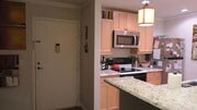 Stainless stell appliances, recessed lights, granite countertops & pendant lights - 6111 Rancho Mission Rd Condo Unit 113