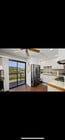 Kitchen with very large new refrigerator - 1035 Olive Ave Apartments Unit 1