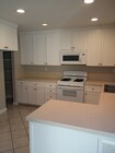 Kitchen with lot of storage area - 19221 Sherman Way Townhome