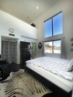 Primary bedroom 24ft ceilings - 1422 Hi Point St Townhome