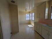 Kitchen, Dining area - 4045 E 8th St Apartments Unit F