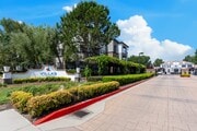 Gated Community Entrance and Signage at Villas at the Gardens Apartments - Villas at the Gardens Apartments